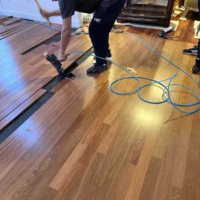 Air movers set across a wet floor to dry it out after a leak