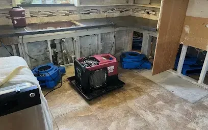 Kitchen cabinet toe kicks pulled off and a dehumidifier running after a supply line leak