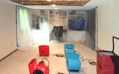 A restoration crew setting drying equipment across a large commercial floor
